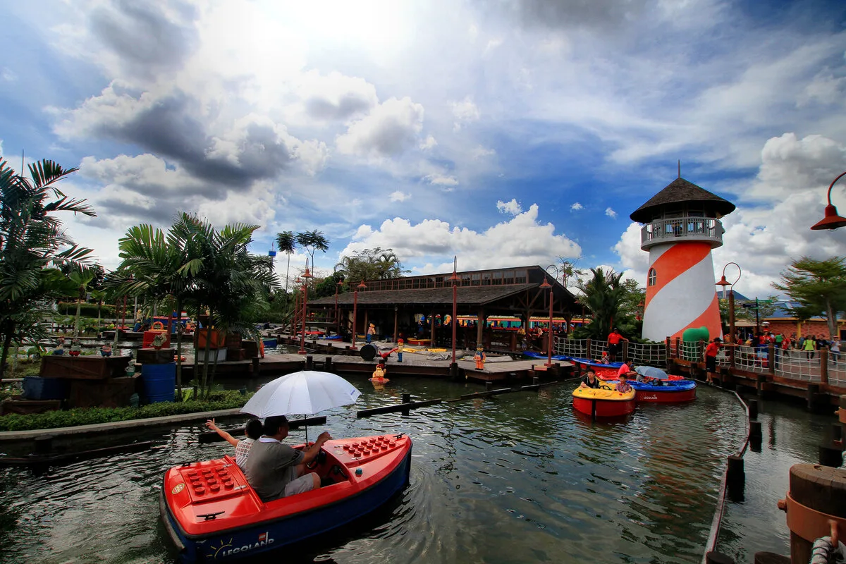 Colourful LEGO boats and a striped lighthouse at Boating School, LEGOLAND Malaysia