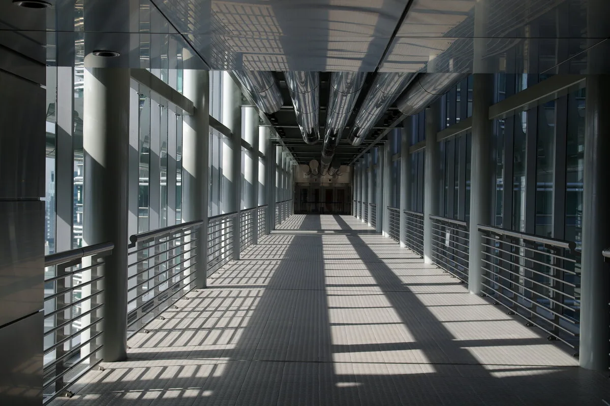 Inside the glass-walled Skybridge walkway between the Petronas Twin Towers in Kuala Lumpur