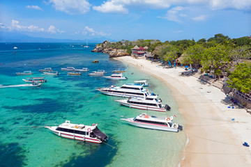 Peaceful view of Nusa Lembongan in Nusa Islands Bali, featuring calm turquoise waters, pristine beaches, and lush mangrove forests under a clear blue sky.