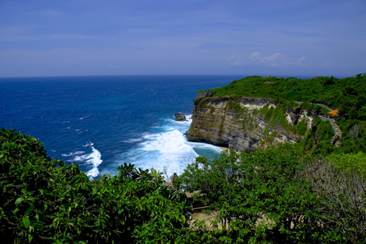 Uluwatu Temple cliffs Bali ocean — bali tour package from delhi