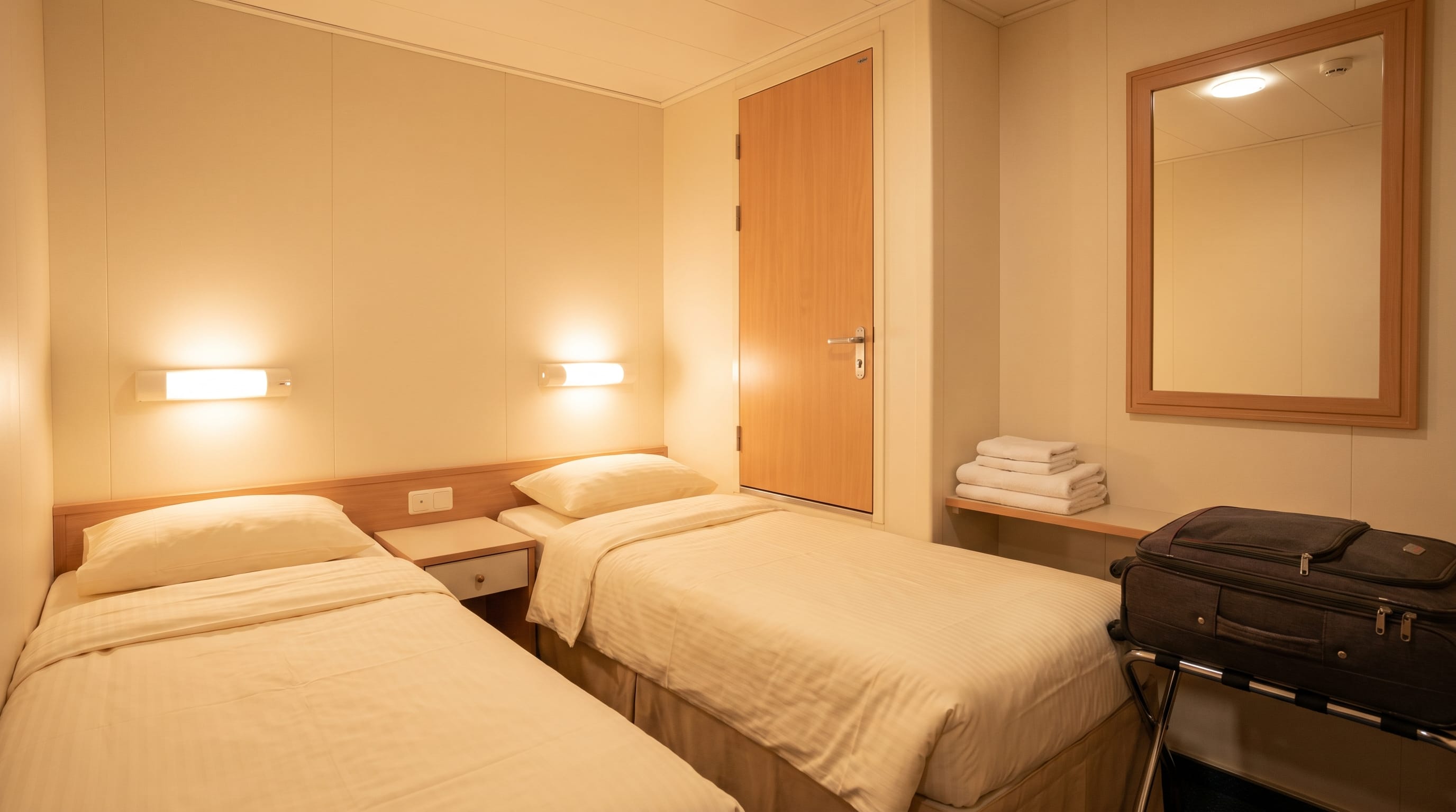 Cosy windowless interior cordelia cruise cabin types stateroom with twin beds