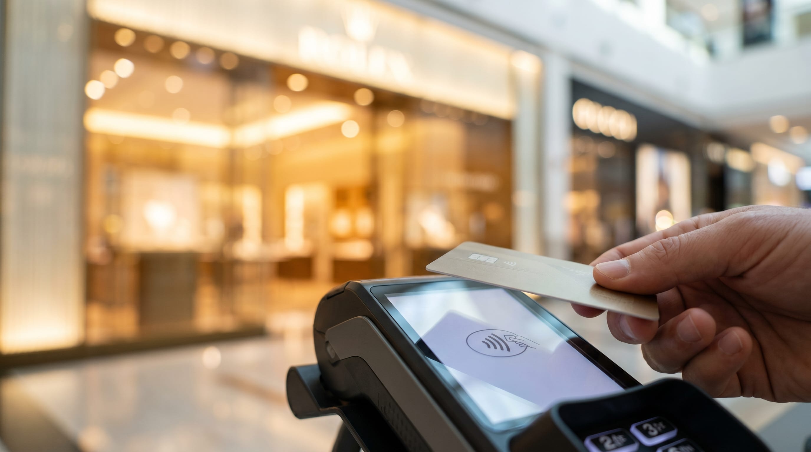 Tapping a contactless card at a Dubai payment terminal instead of using cash