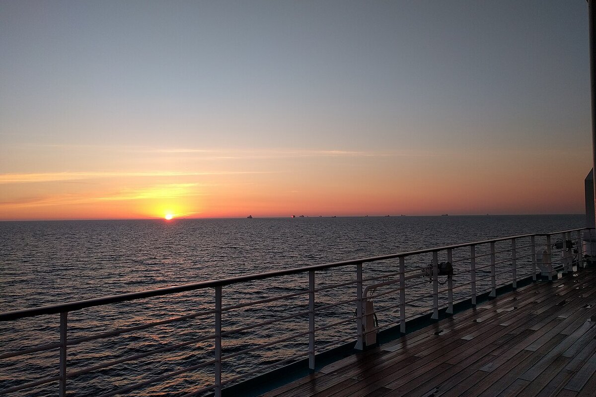 Cruise ship at sea sunset