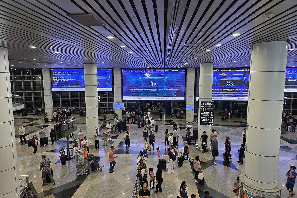 Kuala Lumpur International Airport arrival hall interior — refused entry at airport