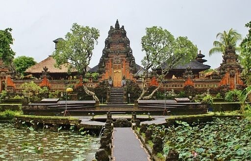 Ubud Palace in Bali surrounded by lush greenery and lotus pond. Best place to visit in Bali