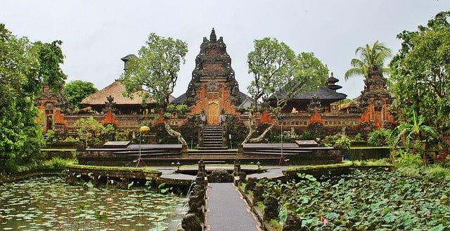 Ubud Palace in Bali surrounded by lush greenery and lotus pond. Best place to visit in Bali