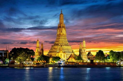 Wat Arun Temple illuminated at twilight in Bangkok, Thailand. best time to visit Thailand.