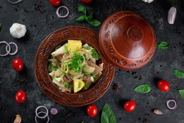 A traditional serving of Beshbarmak, the national dish of Kazakhstan, featuring tender meat