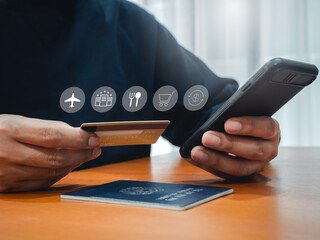 "A close-up of a person booking travel deals using a smartphone and credit card, with icons representing flights, hotels, dining, shopping, and travel essentials. Keywords: Travel Deals: For Couples and Families in Malaysia."