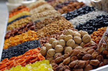 A vibrant scene at the Green Bazaar, showcasing colorful stalls filled with fresh fruits, vegetables, spices, and local products, offering an authentic shopping and cultural experience in the city.