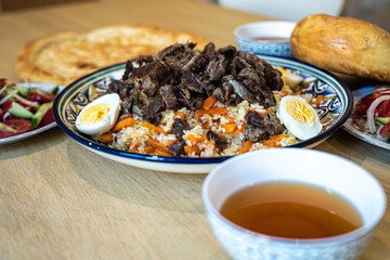 A delightful spread of traditional Kazakh dishes, showcasing the rich flavors and culinary heritage of Almaty's local cuisine.