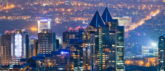 Modern cityscape of Almaty featuring contemporary architecture, bustling streets, and urban charm, highlighting Almaty's modernity and vibrant lifestyle.