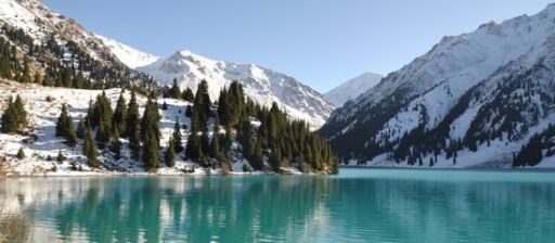 Big Almaty Lake surrounded by snow-capped mountains and lush greenery, offering a serene and breathtaking view - a must-visit spot on your 3-day Almaty itinerary.