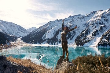 Big Almaty Lake surrounded by snow-capped mountains and lush greenery, offering a tranquil and romantic escape for couples in Almaty.