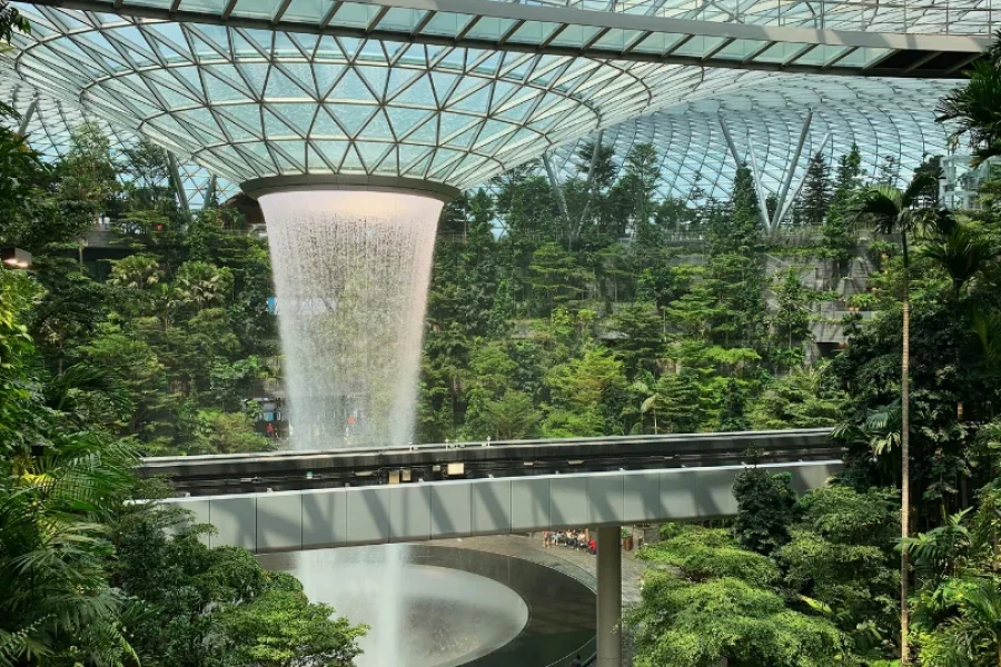 Discover Changi Airport, a world-class aviation hub in Singapore, featuring stunning architecture, lush indoor gardens, and top-notch amenities.